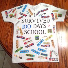 a t - shirt that says i survived 100 days school on it