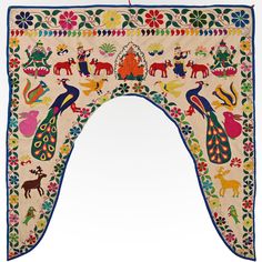 an ornately decorated mirror frame with peacocks and other animals on the outside, in front of a white background