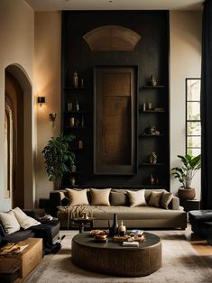 a living room filled with lots of furniture next to a wall mounted book shelf and potted plant