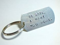 a metal keychain with the words be safe i want you home on it