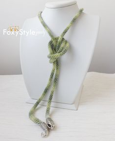 This is a unique handmade necklace from seed beads, high quality cotton thread in green tones with snake head and tail clasp is very flexible and comfortable to wear. This necklace could be lovely accessorize for your look every day, or special evening. This necklace also is a perfect accessory, which can be worn formally or casually to add style to your outfits. It's also a great gift idea. Especially if you're a man and want to give something special to your woman. *MEASUREMENTS: Necklace Leng Handmade Green Beaded Lariat Necklaces, Handmade Green Lariat Beaded Necklace, Crochet Beads, Snake Head, Jewelry Delicate, Gift Crochet, Beaded Crochet, Snake Necklace, Green Jewelry