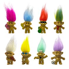 six troll dolls with different colored hair and sunglasses on their heads, one is holding a soccer ball