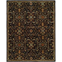 a black and gold rug with an ornate design