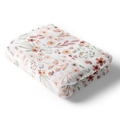 an image of a blanket with flowers on the front and back cover in white background