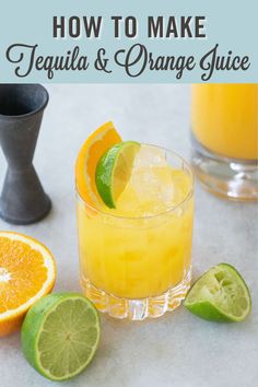 an orange juice is garnished with limes and lemon wedges on the side