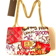 Quilted Graffiti Bag Gold Hardware 9 Inches By 6 Inches By 4 Inches. 20 In Shoulder Drop Chic White Bag With Letter Print, Chic White Bags With Letter Print, Chic White Shoulder Bag With Letter Print, Trendy White Shoulder Bag With Graphic Print, Red Letter Print Bags For Shopping, Casual White Shoulder Bag With Graphic Print, Red Rectangular Bag With Letter Print, Graffiti Bag, Quilted Wallet