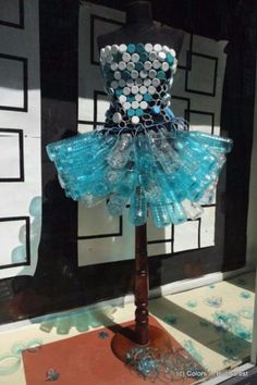 a dress made out of plastic bottle caps