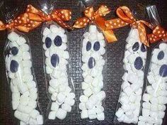 four bags filled with marshmallows and orange bows