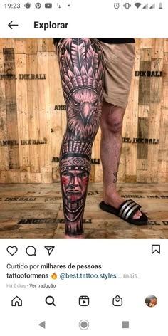 a man's leg with tattoos on it