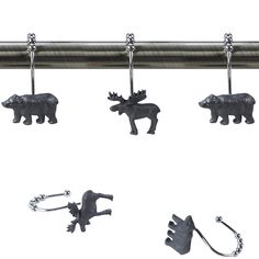 four metal animals hanging from a curtain rod