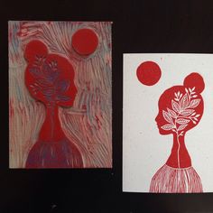 two red and white cards with designs on them, one in the shape of a woman's head