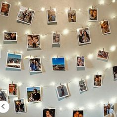 several pictures are hung on the wall with string lights strung around them and there is no image to describe