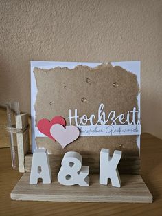 a couple of wooden letters sitting on top of a table