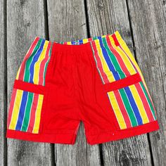 We offer FREE WORLDWIDE SHIPPING on all of our items. Please check measurements for most accurate fit. All measurements are done in inches and with item laying flat. Feel free to message with any questions.  Tag size: N/A Measurements in pictures  Flaws: N/A Retro Cotton Shorts With Elastic Waistband, Retro Cotton Bottoms With Built-in Shorts, Retro Red Beach Shorts, Multicolor Cotton Shorts With Elastic Waistband, Retro Striped Short Bottoms, Retro Striped Short-length Bottoms, Striped Cotton Shorts With Pockets, Red Bermuda Cotton Shorts, Multicolor Cotton Bermuda Shorts