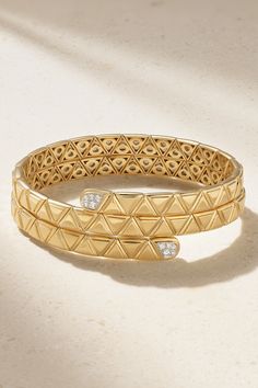 Marina B's 'Triangolini' bangle is defined by its triangular engraving - an intricate detail seen on every piece in the 'Triangoli' collection. Handmade from 18-karat gold, it has a stacked design that wraps comfortably around your wrist and is tipped with a cluster of pavé diamonds. Luxury Diamond Cut Bangle, Luxury Stackable Bangle For Formal Occasions, Luxury Stackable Bangle For Formal Events, Luxury Engraved Diamond Bracelet, Luxury Stackable Bangle, Luxury Stackable Diamond Bracelet, Elegant Yellow Gold Triangle Jewelry, Elegant Triangle Yellow Gold Jewelry, Latest Bracelets