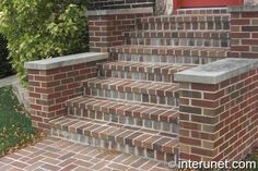 brick steps leading up to a red door