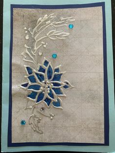 a piece of paper with blue and white designs on it