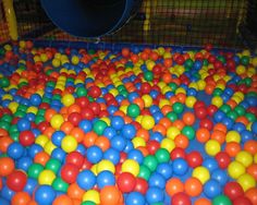 an indoor play area with many balls in it