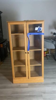 a book case with a blue ribbon on it