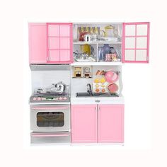 a toy kitchen with pink cabinets and appliances