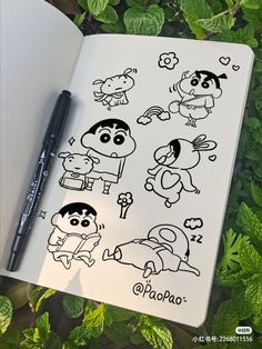 an open notebook with cartoon stickers on it