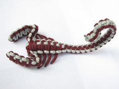 a red and white rope on a white background