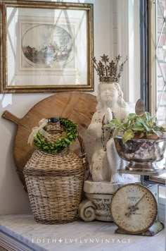 an assortment of decorative items displayed on a mantle