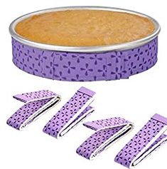 four pieces of cake in a tin with purple polka dots on it and the top is cut