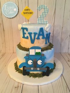 a birthday cake with a blue truck on top