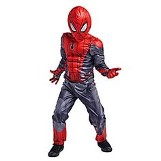 a young boy in a spiderman costume standing with his hands out to the side