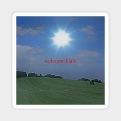 an open field with trees and the words welcome back written in red across the image