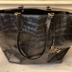 Croc-Embossed Leather Lends A Glam Look To This Flared Dvf Tote. Recessed Zip Top Closure Opens To A Lined, 5-Pocket Interior. Thin, Flat Double Handles. Leather: Cowhide New With Tags Measures Approximately Height 9.75in / 25 Cm Length: 17.5 In / 44cm Depth: 5.25in / 13.5cm Handle Drop: 9.75in / 25cm Style #H2337063g15 100% Authentic With Dvf Authenticity Tag Hanging Dvf Logo Charm Dvf Diane Von Furstenberg, Glam Look, Tote Bag Black, Glam Looks, East West, Black Tote Bag, Zip Top, Von Furstenberg, Diane Von