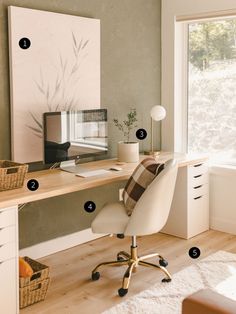 a home office with white furniture and wood flooring