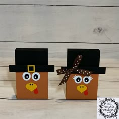 two turkey boxes with hats on each one