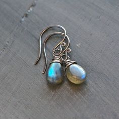 Simple smooth labradorite briolettes wire wrapped in sterling silver. They come with hand forged ear wires. Oxidized and hand polished.  Dimensions: Overall Lengths: about 1 in Labs: about 10-12 mm Please enter my main store at: ★ http://www.etsy.com/shop/mayahelena ★ Thanks for looking! Wrapped Earrings, Sterling Silver Wire Wrap, Wire Wrapped Earrings, Hand Forged, Silver Wire, Ear Wires, Wire Wrapped, Wire Wrapping, Labradorite