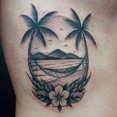 a woman's stomach with two palm trees and a hammock on it