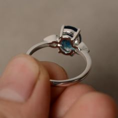 This is a gorgeous handmade creation. Its beauty is its simplicity & Elegance. The 7*9mm oval cut London blue topaz is crafted in solid sterling silver and with rhodium plated. All item is sent in a beautiful gift box You can realize more lovely stuff clicking the link https://www.etsy.com/shop/knightjewelry?refshopsection_shophome_leftnav Please leave the correct address and you phone number for delivering successfully. Modern Oval Blue Topaz Ring, Modern Oval Topaz Ring With Prong Setting, Oval Blue Topaz Ring With Polished Finish, Oval Topaz Promise Ring With Polished Finish, Modern Blue Topaz Oval Ring, Polished Blue Topaz Ring For Wedding, Oval Solitaire Blue Topaz Ring, Oval Blue Topaz Solitaire Ring, Modern Oval Topaz Promise Ring