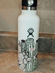 a white water bottle sitting on top of a counter