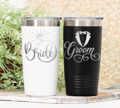 two bride and groom tumblers sitting next to each other