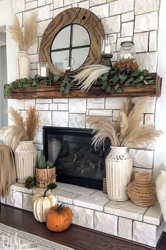 a fireplace with some plants and candles on it