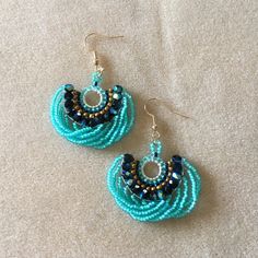 Beautiful Peacock Colored Hand Beaded Loopy Earrings Elicits Thoughts Of Exotic Faraway Places... Measures Approximately 2” Long Including Ear Wires X 1-3/4” Wide Materials: Glass Beads, Nylon Thread, Gold Plated Alloy Ear Wires. Blue Faceted Beads Beaded Earrings For Party, Blue Faceted Beads Earrings For Party, Blue Faceted Beaded Earrings For Party, Blue Large Beads Drop Earrings, Blue Beaded Drop Earrings With Large Beads, Blue Large Beaded Drop Earrings, Turquoise Beaded Earrings For Party, Adjustable Turquoise Beaded Earrings For Party, Beachy Earrings