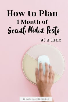 someone's hand on a mouse pad with the text how to plan 1 month of social media posts at a time