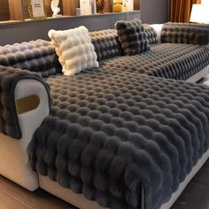 a large couch with several pillows on it