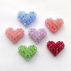 four different colors of heart shaped beads