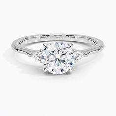 a white gold engagement ring with three stones