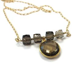 This brown smoky quartz necklace created by Jewelry by CARMAL is made of: smoky quartz cube gemstones, smoky quartz and gold filled pendant, gold filled: chain, spring ring clasp and findings. This necklace measures 18 inches in length. View more chain necklaces: http://www.etsy.com/shop/jewelrybycarmal?section_id=8001511 All of our jewelry comes wrapped and ready for gift giving! We also offer free standard shipping within the United States. We accept custom orders and would love to work with y Faceted Smoky Quartz Jewelry As Gift, Faceted Smoky Quartz Jewelry For Gift, Gold Smoky Quartz Necklace For Gift, Smoky Quartz Jewelry, Smoky Quartz Necklace, Bead Bar, Bar Jewelry, Brown Necklace, Gold Chain With Pendant