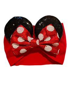 Our Chunky Red Polka Dot Bow Mouse Ear Baby Headband – the ideal companion for your day of whimsical adventures! Designed to add a touch of magic to your ensemble, this delightful accessory features a dazzling 5" traditional red and white polka dot bow attached to 3.25" black sequin mouse ears on a cotton fabric headband. Whether you're headed to a theme park, a costume party, or simply want to infuse a bit of fun into your day, our mouse ear headband is sure to cast a spell on you and everyone Themed Adjustable Hair Accessories For Gifts, Playful Adjustable Bow Headband, Playful Bow Headband For Gift, Adjustable Playful Bow With Matching Headband, Playful Adjustable Bow With Matching Headband, Adjustable Red Bow Hair Accessories, Adjustable Red Hair Accessories With Bow, Red Bow Hair Accessories, Adjustable Red Fun Headband