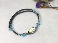 These gemstone and Swarovski Crystal bracelets will adjust themselves to fit most any sized wrist.  They can be slightly bent if they are a little large for a petite wrist. They also have no clasps. They're really easy put on - you won't need help. They simply stretch to open and then spring closed around your wrist. They're great for someone who has arthritic fingers. They are designed to fit snugly so they won't drag on a desk or table. They also won't stretch out. Since these bracelets will f Adjustable Single Strand Beaded Bracelets, Adjustable Single Strand Beaded Bracelet, Adjustable Single Strand Bracelet As Gift, Memory Wire Bracelet, Swarovski Crystal Bracelet, Memory Wire Bracelets, Memory Wire, Wire Bracelet, Crystal Bracelets