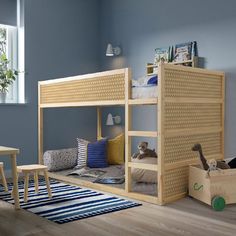 a child's bedroom with bunk beds and toys