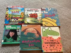 several children's books laid out on the floor